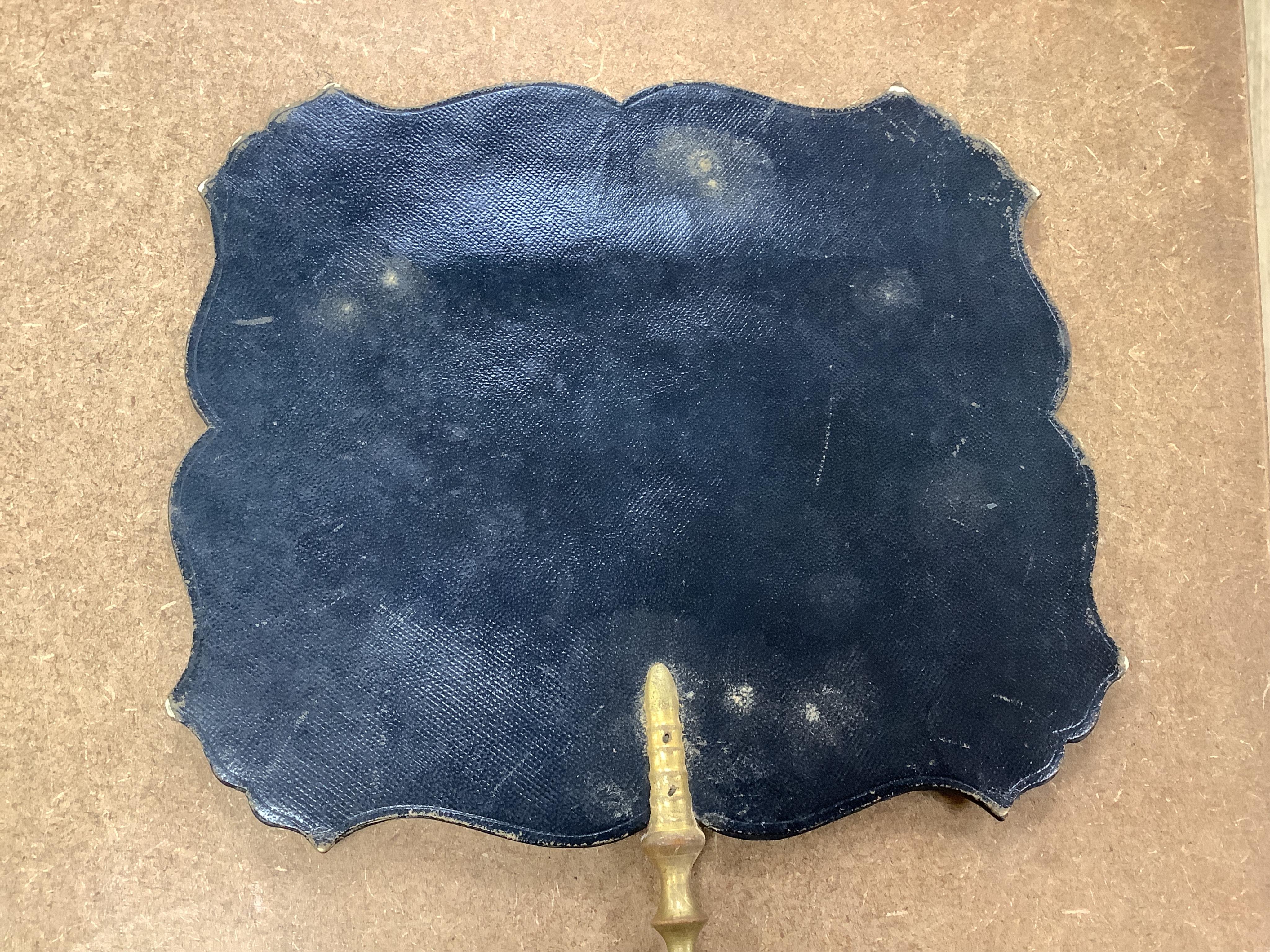 A pair of early Victorian papier maché hand screens, each with embroidered with cross stitched flowers, 41cm in length